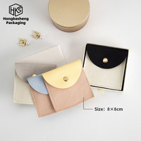 Pochette à bijoux en microfibre bicolore avec rabat incurvé et bouton-pression doré, sac de rangement pour accessoires (bagues, boucles d'oreilles, colliers)