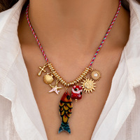 Collier multi-pendentifs en alliage pour femme, motif poissons, étoiles de mer et coquillages, collection été 2026 Qingdao Comiya Accessories
