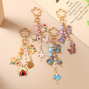 Nuevos modelos transfronterizos: Llaveros de cuentas, llaveros de mariposa, mariquita y flor, y dijes para bolsos, los más vendidos y clasificados. - Product Image 3