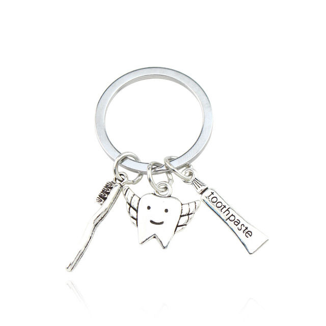 Wholesale Alloy Cute Teeth Dentistry Dentist Enamel Keychains Toothpaste Shaped Dental Keyring Gifts