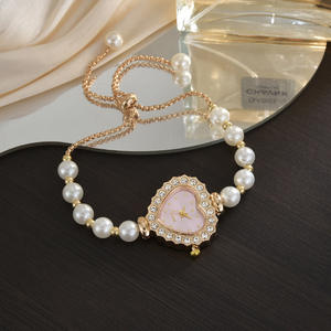 Montre élégante et tendance de style scolaire ovale de luxe pour étudiants unisexes, avec un cœur serti de diamants, une boucle à tirette en perle - Product Image 3