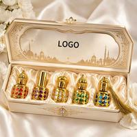 Flacon de parfum cylindrique en verre de 10 ml avec bouchon à vis, pierres précieuses en filigrane doré, applicateur à bille pour bâtonnet, pulvérisateur, flacon rechargeable