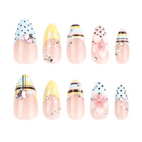 Vente en gros de faux ongles en acrylique de style français en forme d'amande |   Ongles personnalisables aux couleurs pastel avec motifs à pois, étoiles et fleurs