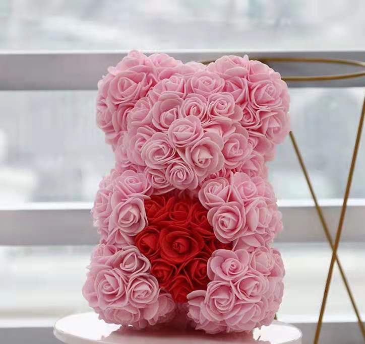 thin pink bear with red heart with box