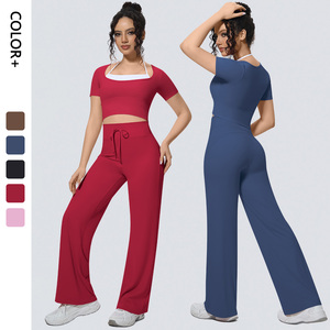 Set Yoga all'ingrosso da <span class=keywords><strong>Donna</strong></span> con <span class=keywords><strong>Top</strong></span> Sportivo a Maniche Corte Halter e Pantaloni a Gamba Larga Imbottiti Effetto Seconda Pelle - Set Fitness - Product Image 1