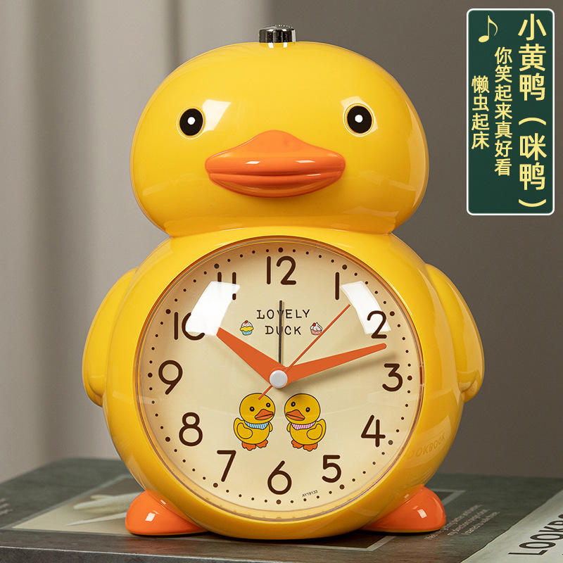 Patito amarillo con cara blanco-amarilla + despertador con melodía.
