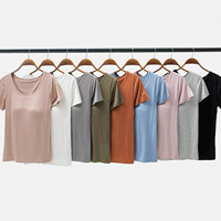 T-shirts de yoga pour femmes à logo personnalisé, respirants, décontractés, d'été, à manches courtes, couleur unie, col rond, séchage rapide, avec coussinet de poitrine