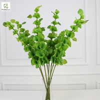 Vente en gros de tiges de verdure artificielle au toucher réel, feuilles de clochettes d'Irlande (Moluccella laevis Pall.) pour la décoration de table d'hôtel