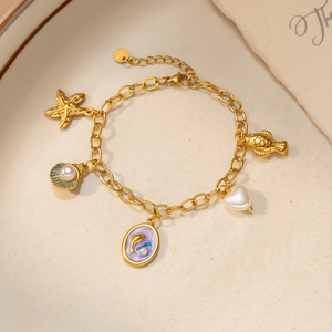 Nouveau bracelet en or plaqué 18 carats avec perle de dauphin pour femmes, bracelet multi-breloques en acier inoxydable, merveilles de l'océan - Product Image 1