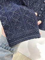 Ensemble de vêtements en tricot de luxe de style modeste 2026 pour femmes, printemps, perles en strass, col rond, décontracté, ensemble de pull 2 pièces, ensemble de jupe mi-longue