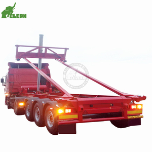 Semi-<span class=keywords><strong>remorque</strong></span> porte-conteneurs hydraulique <span class=keywords><strong>de</strong></span> 20 pieds et 40 pieds avec benne <span class=keywords><strong>basculante</strong></span> avant <span class=keywords><strong>pour</strong></span> la vente - Product Image 1