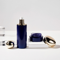 Ensemble cosmétique de luxe en verre OEM personnalisé en gros, 1oz/30-150ml 30-100g, avec capuchon bleu et doré pour sérum, lotion, fond de teint, crème