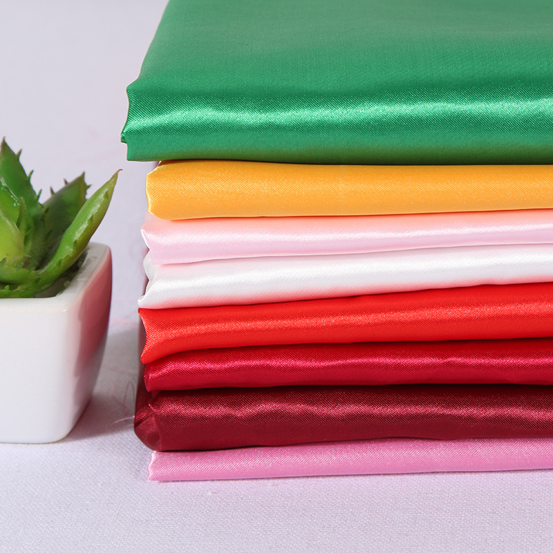 Factory makes stock fabric polyester satin decorative fabric