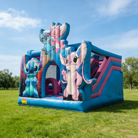 Château gonflable commercial à thème Stitch avec toboggan, en PVC bleu, pour la location de jeux d'enfants