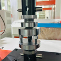 Máquina de prueba universal de doble columna 2KN Servo de computadora con resistencia de almohadilla de goma 220V 1 año de garantía