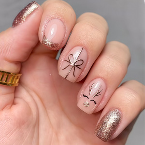 Uñas postizas de Navidad con diseño de lazo de regalo, cuernos y purpurina fina, puntas francesas lindas y sencillas, para fiestas navideñas, salón o DIY - Product Image 1