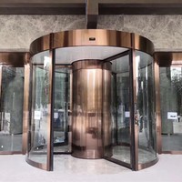 Porte tournante moderne à deux ailes en verre pour supermarchés et bâtiments d'entreprise avec commande manuelle et design de colonne annulaire en verre intelligent