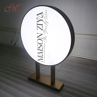 Boîte d'éclairage à LED en acrylique double face personnalisée cadre circulaire en métal pour la publicité commerciale extérieure populaire dans les magasins