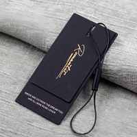 Étiquette personnalisée en papier noir texturé épais avec gaufrage à chaud doré pour boutiques de vêtements haut de gamme pour femmes