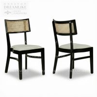 Chaise de salle à manger moderne de style mid-century en bois noir avec dossier en rotin, siège rembourré, idéale pour hôtels, événements extérieurs, mariages, prête à la location