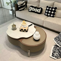 Table basse rotative en forme de pétale, style moderne minimaliste, luxe léger, haut de gamme, nouvelle collection, pour salon.
