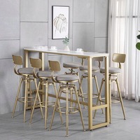 Table de bar moderne de luxe avec deux tabourets hauts pivotants, structure en métal, pour la maison, les hôtels, les centres commerciaux dans un décor de salle à manger élégant