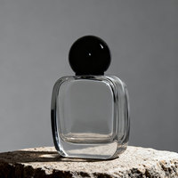 Venta al por mayor de botellas de perfume de vidrio transparente de 30ml, 50ml, 100ml, vacías, con pulverizador, serigrafía, tapa negra de rosca, difusor de varillas para