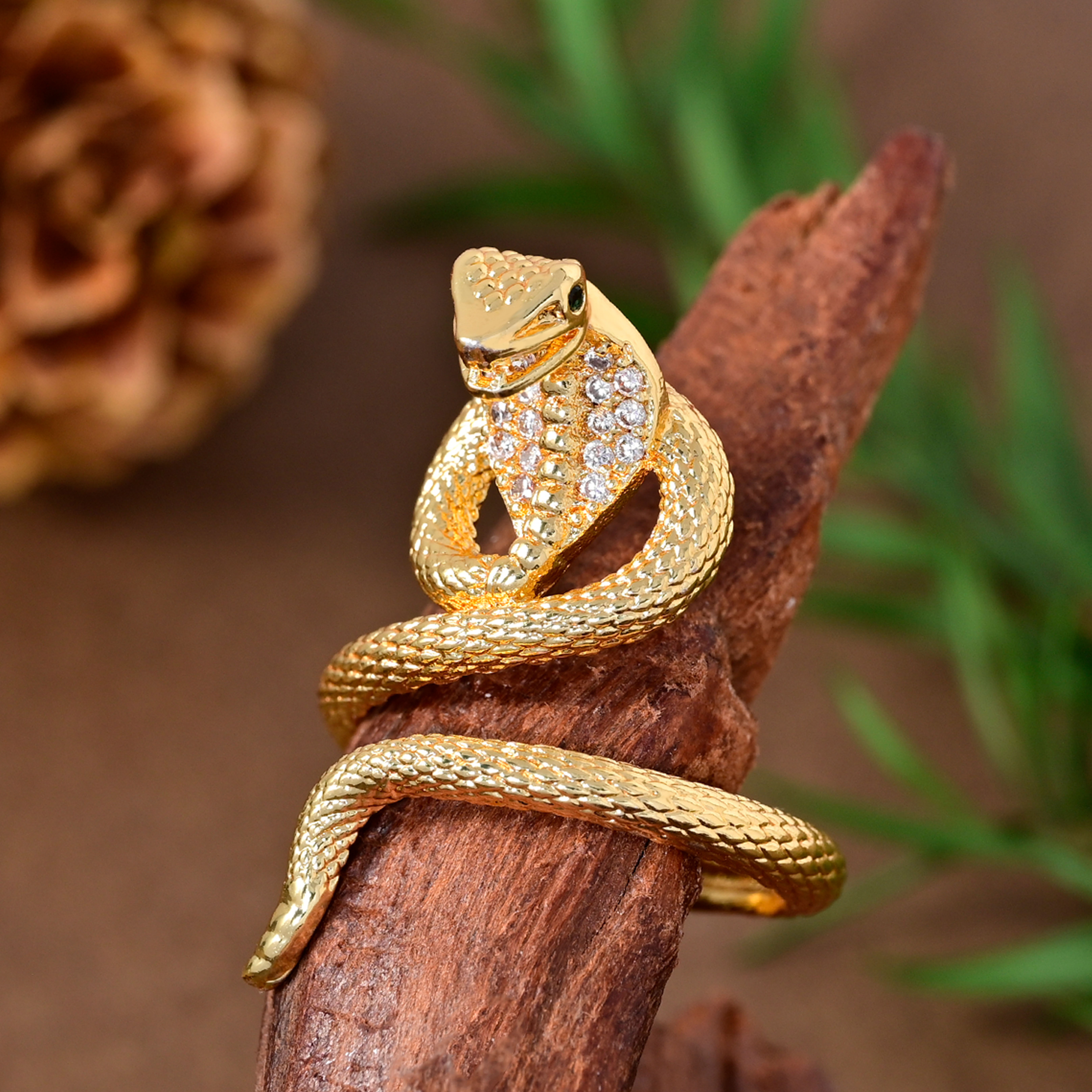 Roségouden slang ring met diamant en robijn