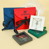 Ensemble de pochettes à bijoux et boîtes de présentation A1 Teal avec fermeture à nœud et bouton, et emballage personnalisé avec logo
