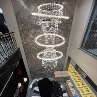 Grandes lampes suspendues modernes de style nordique Décoration personnalisée de mariage d'hôtel Lustre en or-Salon Cristal Fer Long Luxe Haut Plafond