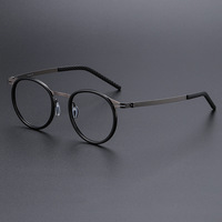 Lunettes de vue universelles à monture ronde en alliage de titane avec verres optiques en plastique pour hommes et femmes