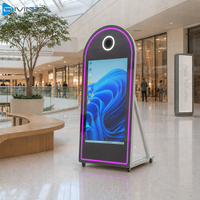 Machine Photobooth Portable avec Miroir, Kiosque Selfie à Écran Tactile 65 Pouces pour Location Événementielle, Mariages et Salons Professionnels