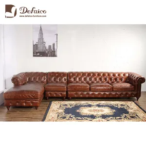 Vintage Used Chesterfield Corner Leather Sectional Sofa In LIving Room Hotel Reception Room