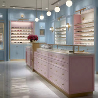 Comptoir d'exposition moderne de luxe en acier inoxydable avec éclairage LED, marque Maxsen, options or/noir pour lunettes haut de gamme sur mesure