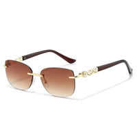 Lunettes de soleil sans monture à perles tendance pour femmes
