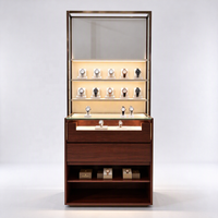 Vitrine d'exposition de montres avec cadre doré, éclairage LED, supports en acrylique, tiroirs et étagère ouverte, certifiée CE ETL, pour les boutiques de montres