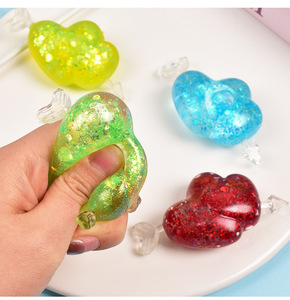 Juguete Blandito de Piruleta con Corazón Brillante, TPR Maltosa de Ascenso Lento, Juguete Antiestrés con Lentejuelas Transparentes para Alivio del Estrés y Descompresión - Product Image 1