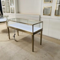 Vitrine de présentation de bijoux haut de gamme en acier inoxydable plaqué titane, verre trempé transparent, éclairage LED pour centres commerciaux