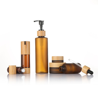 Emballage de maquillage et de soins de la peau Ensemble de bouteilles vides de luxe en bambou Bouteille en verre ambré avec couvercle en bambou Ensemble de voyage pour soins de la peau