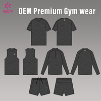 T-shirt de sport pour homme OEM HUCAI, personnalisé, en nylon respirant, imprimé camouflage jacquard, coupe régulière, séchage rapide, pour fitness et entraînement en salle de sport