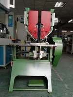 Nouvelle machine pneumatique de perforation de boucles en jean haute précision pour le traitement de boucles à ressort en métal à cinq griffes quatre-en-un pour jeans