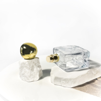 Vente directe usine : Flacons de parfum vides rectangulaires 100 ml, flacons de luxe avec atomiseur et vaporisateur.