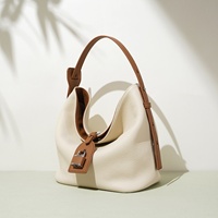Sac seau bandoulière en cuir véritable haut de gamme pour femme 2026, grande capacité, style décontracté, avec rabat et design imperméable