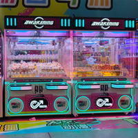 Machine à grue à double poste avec espace de rangement extra large, conception adaptée aux enfants, hauteur personnalisable pour la distribution interactive de jouets en boîte surprise