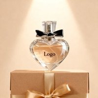 Flacon de parfum sphérique en verre transparent de luxe en forme de cœur 100 ml 50 ml 60 ml 100 ml avec bouchon et vaporisateur personnalisé Boîte d'emballage