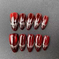 Vente en gros d'usine, faux ongles faits à la main de haute qualité, forme amande rouge, style œil de chat, réutilisables