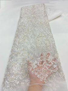 Tissu en dentelle française blanc brodé de perles et de sequins pour robes de mariée, prix de gros usine, idéal pour les femmes nigérianes - Product Image 1