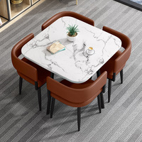 Ensemble de table à manger en pierre moderne, finition brillante, design gain de place, pieds en métal, 4 chaises en cuir artificiel pour la maison et l'hôtel