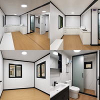 Maison conteneur grise à grain de bois, maison modulaire préfabriquée à ossature acier avec cuisine, salle de bain et portes à cadre noir, fournisseur en gros