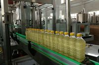 Machine de remplissage linéaire d'huile comestible de haute qualité 3000 BPH pour huile végétale et huile de cuisson avec système de remplissage automatique des bouteilles